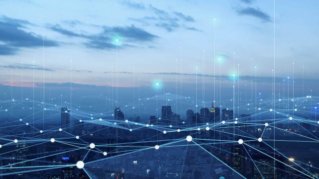 cityscape connected by digital lines